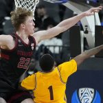 Stanford's James Keefe (22) guards Arizona State's Luther Muhammad (1) during the second half of an NCAA college basketball game in the first round of the Pac-12 tournament Wednesday, March 9, 2022, in Las Vegas. (AP Photo/John Locher)