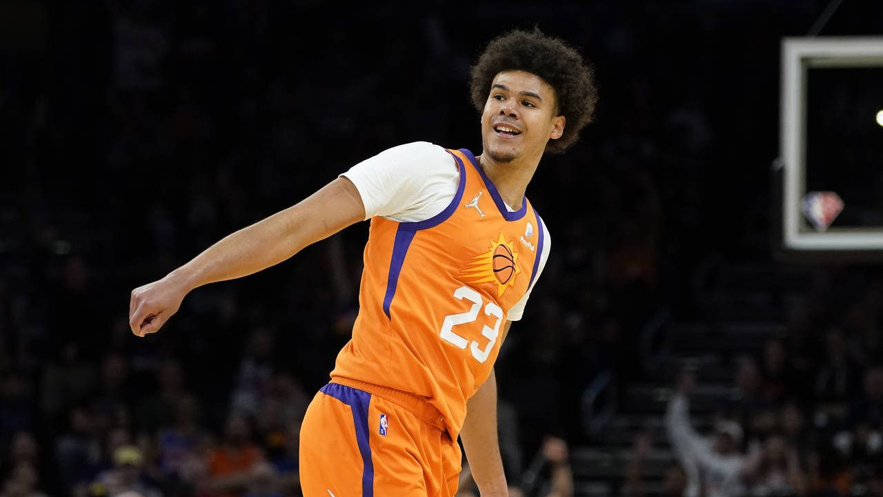Phoenix Suns forward Cameron Johnson (23) smiles after a three pointer against the New York Knicks ...