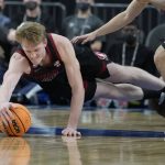 Stanford's James Keefe (22) dives for the ball against Arizona State during the second half of an NCAA college basketball game in the first round of the Pac-12 tournament Wednesday, March 9, 2022, in Las Vegas. (AP Photo/John Locher)