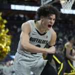 Colorado's KJ Simpson (2) celebrates after a play against Oregon during the second half of an NCAA college basketball game in the quarterfinal round of the Pac-12 tournament Thursday, March 10, 2022, in Las Vegas. (AP Photo/John Locher)