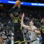 Oregon's Franck Kepnang (22) shoots against Colorado during the first half of an NCAA college basketball game in the quarterfinal round of the Pac-12 tournament Thursday, March 10, 2022, in Las Vegas. (AP Photo/John Locher)