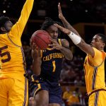 California guard Joel Brown (1) passes as Arizona State guard Jay Heath (5) defends during the first half of an NCAA college basketball game, Thursday, March 3, 2022, in Tempe, Ariz. (AP Photo/Matt York)