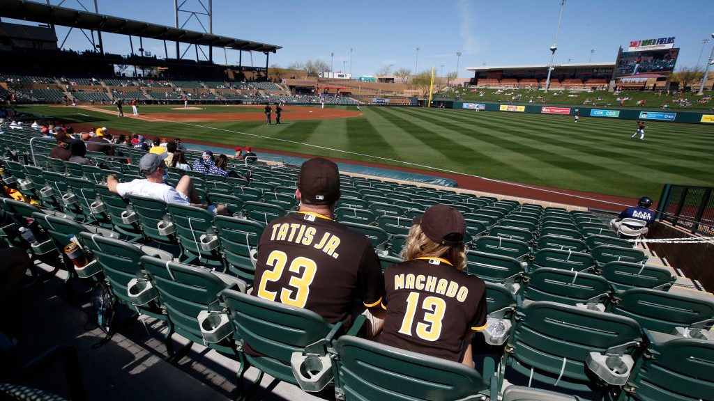 San Diego Padres fans watch the Cactus League spring training baseball game between the San Diego P...