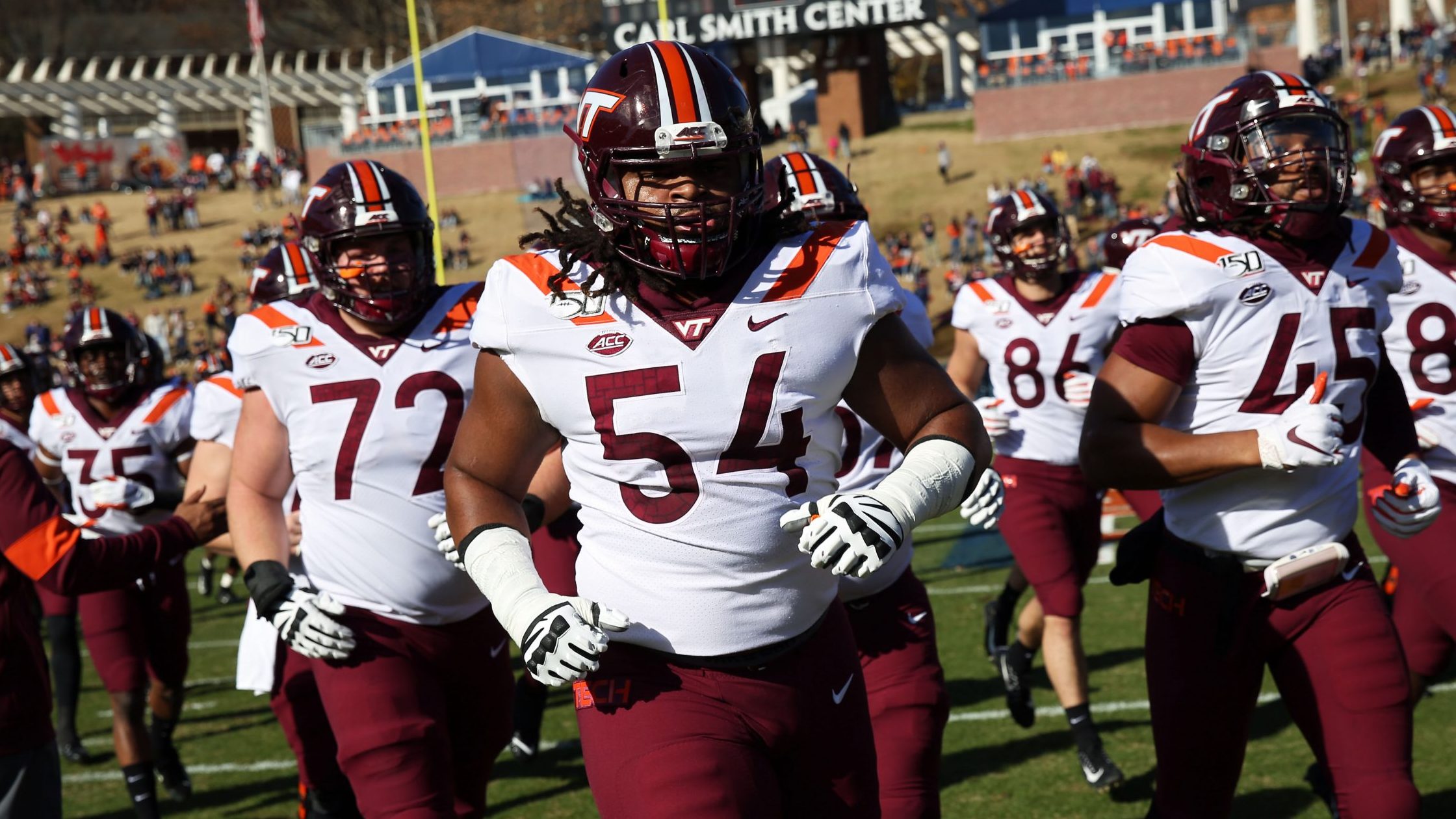 Lecitus Smith #54 of the Virginia Tech Hokies runs off the field before the start of a game against...