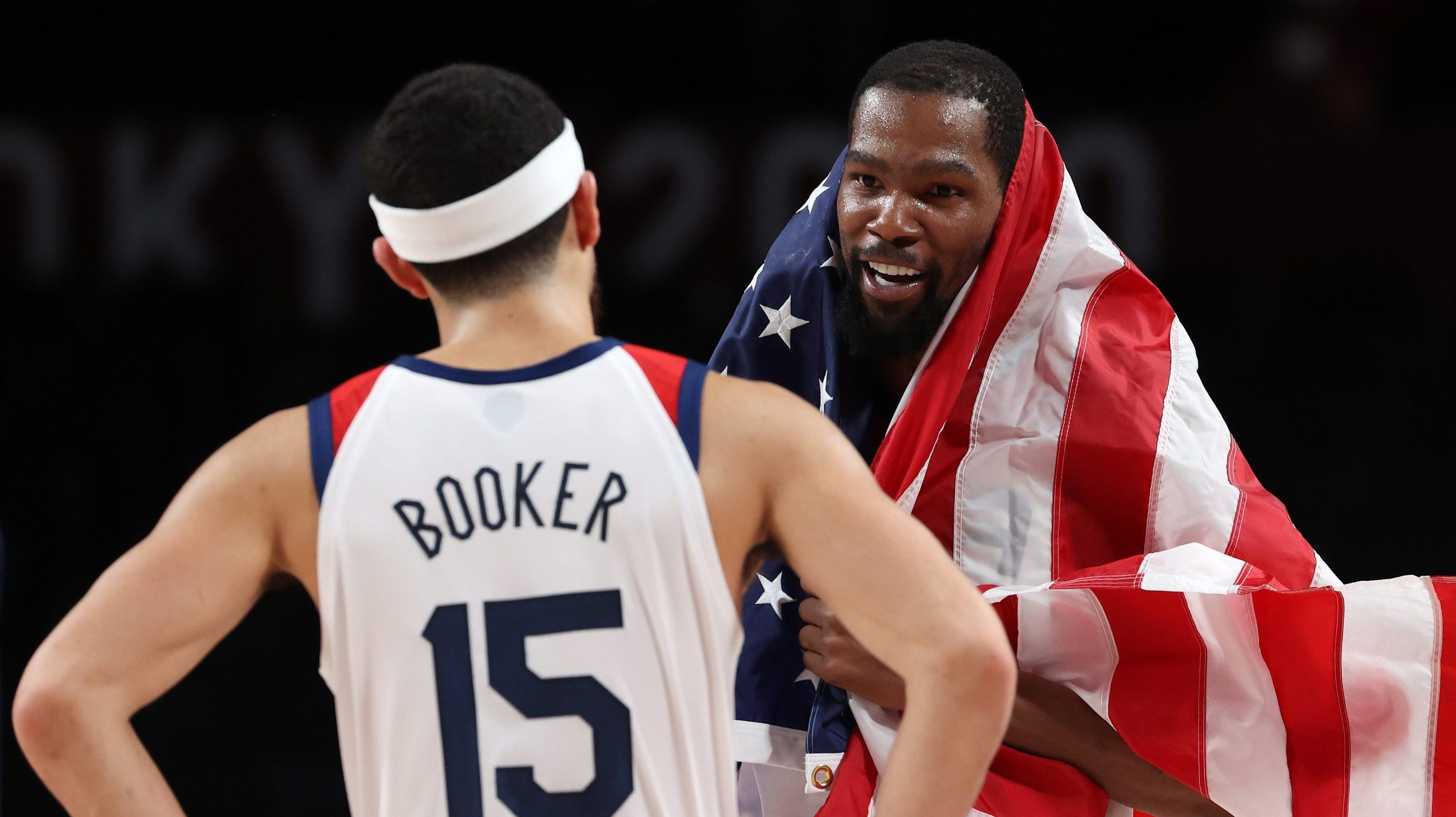 Kevin Durant #7 and Devin Booker #15 of Team United States celebrate following their victory over F...