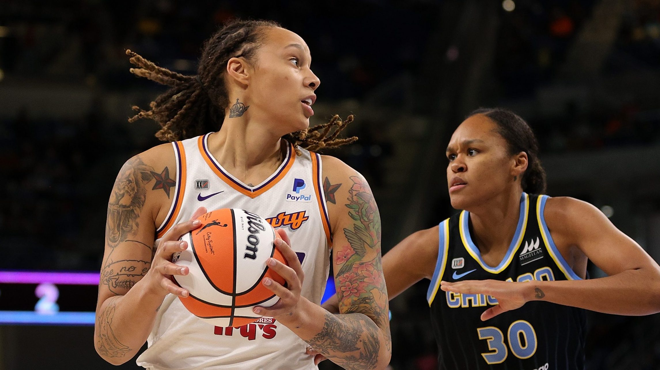 Brittney Griner #42 of the Phoenix Mercury is defended by Azurá Stevens #30 of the Chicago Sky dur...