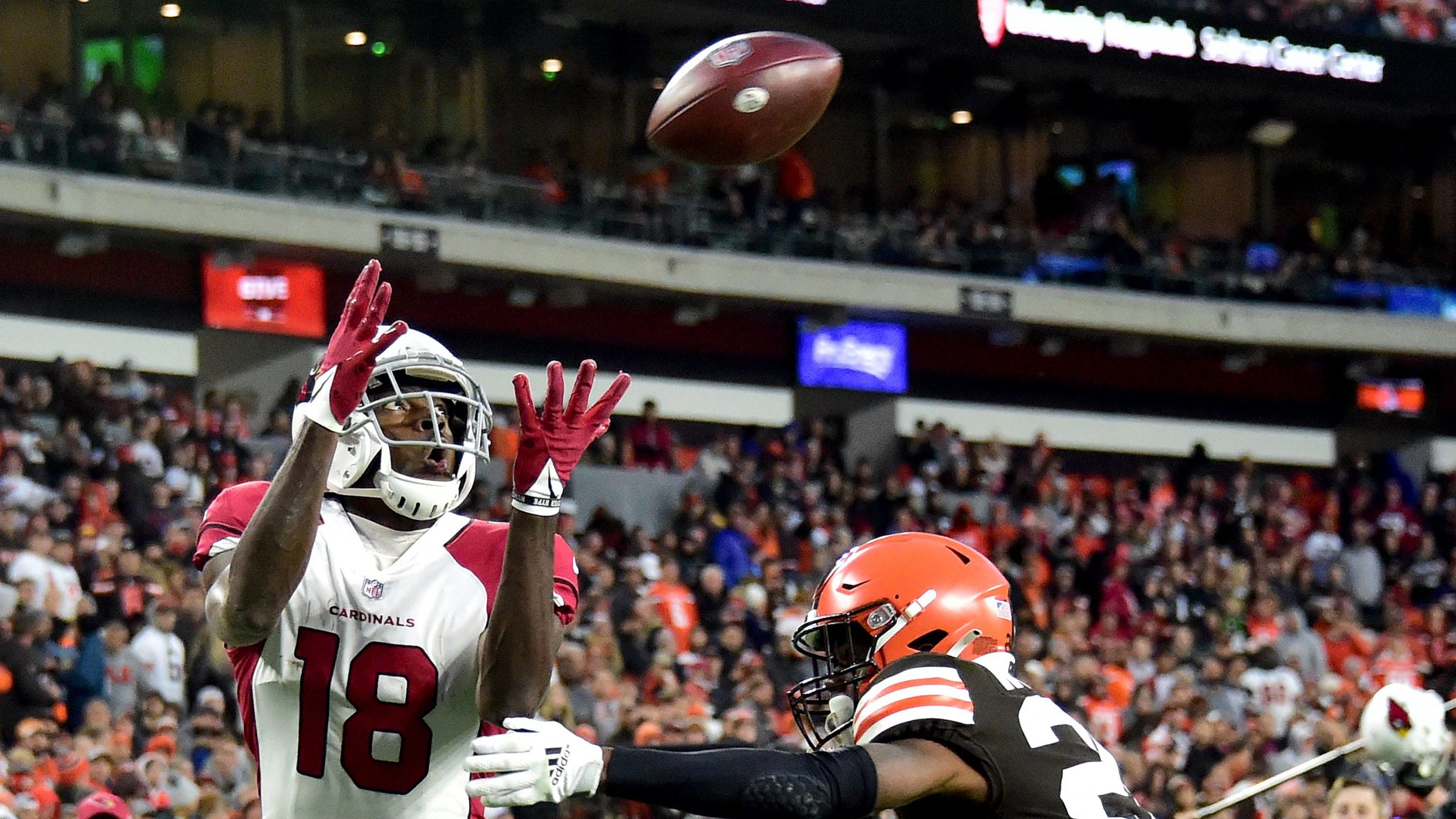 A.J. Green #18 of the Arizona Cardinals catches a touchdown pass under pressure by Greedy Williams ...