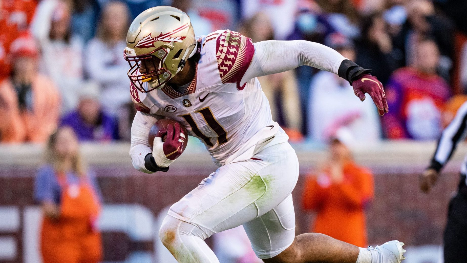 Defensive end Jermaine Johnson II #11 of the Florida State Seminoles scores a defensive touchdown w...