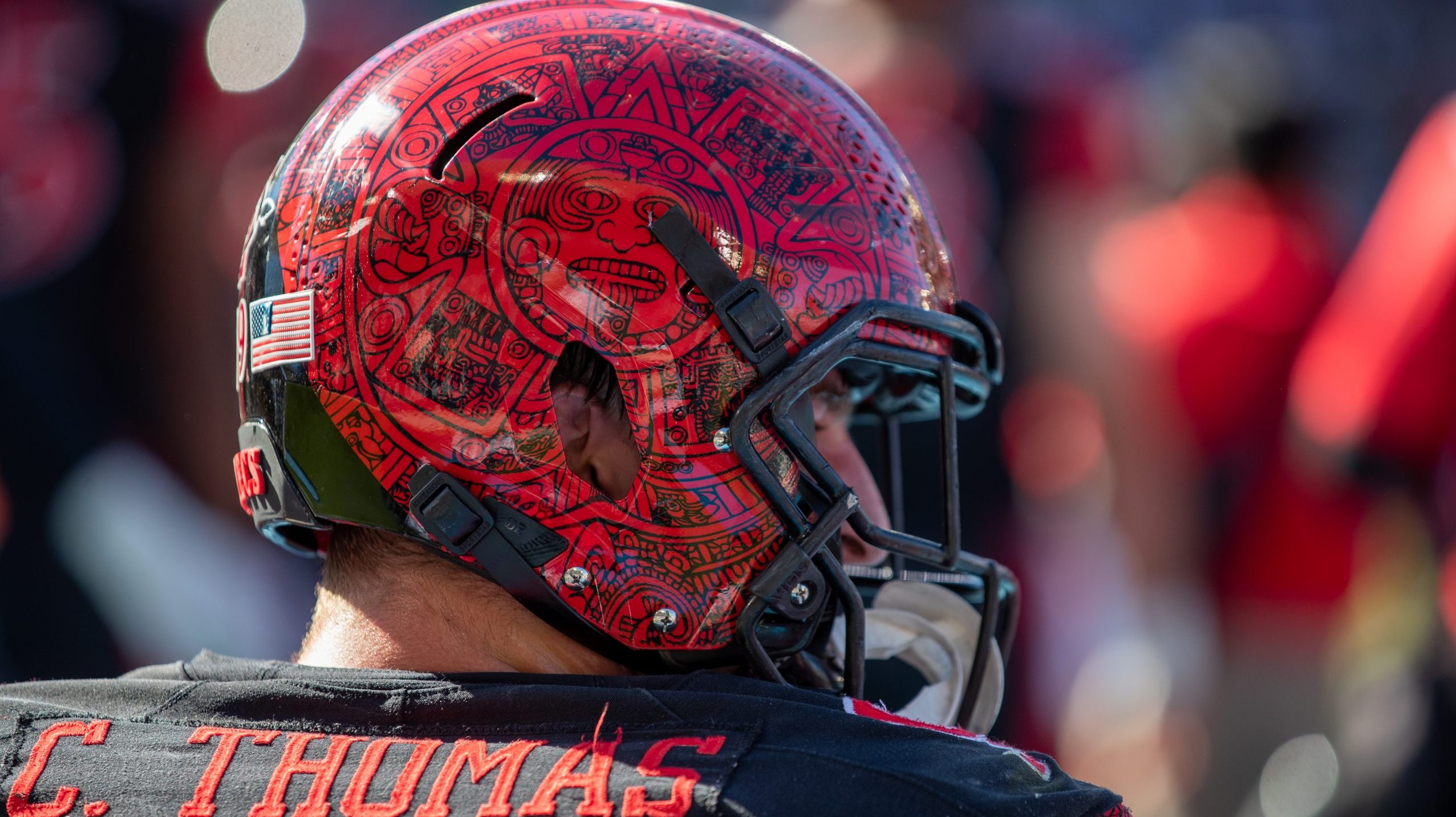 A close up of Cameron Thomas #99 of the San Diego State Aztecs helmet against the Boise State Bronc...