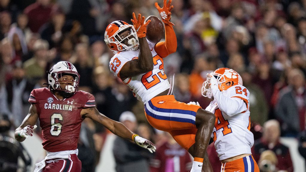 Cornerback Andrew Booth Jr. #23 of the Clemson Tigers makes an interception on a pass intended for ...