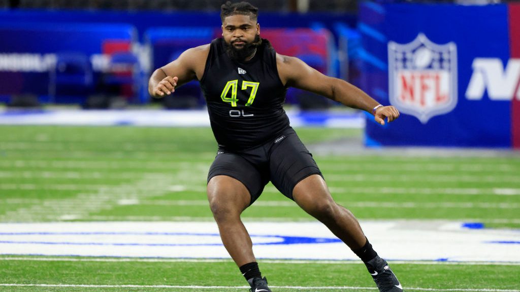 Lecitus Smith #OL47 of Virginia Tech runs a drill during the NFL Combine at Lucas Oil Stadium on Ma...