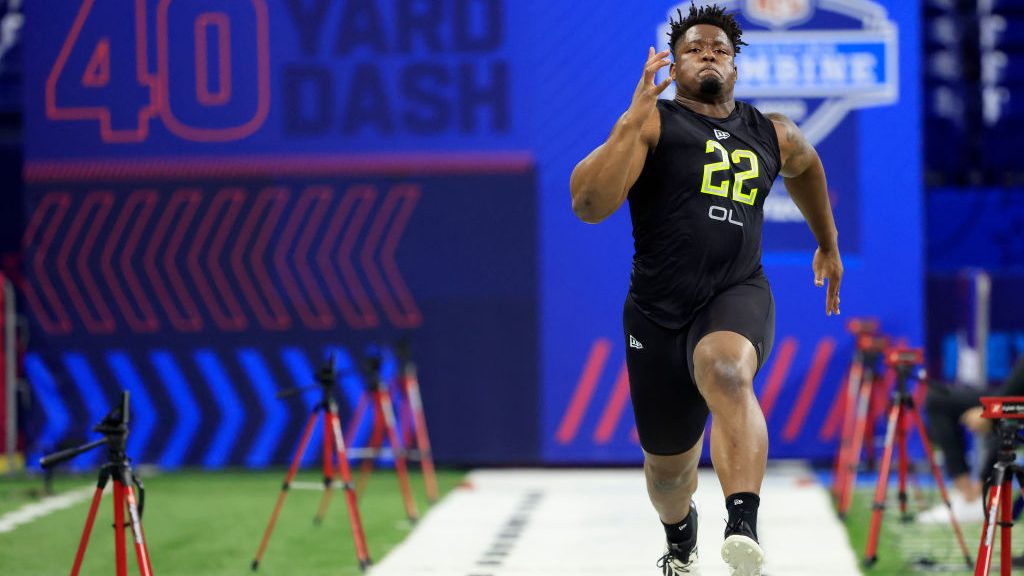 Zion Johnson #OL22 of Boston College runs the 40 yard dash during the NFL Combine at Lucas Oil Stad...