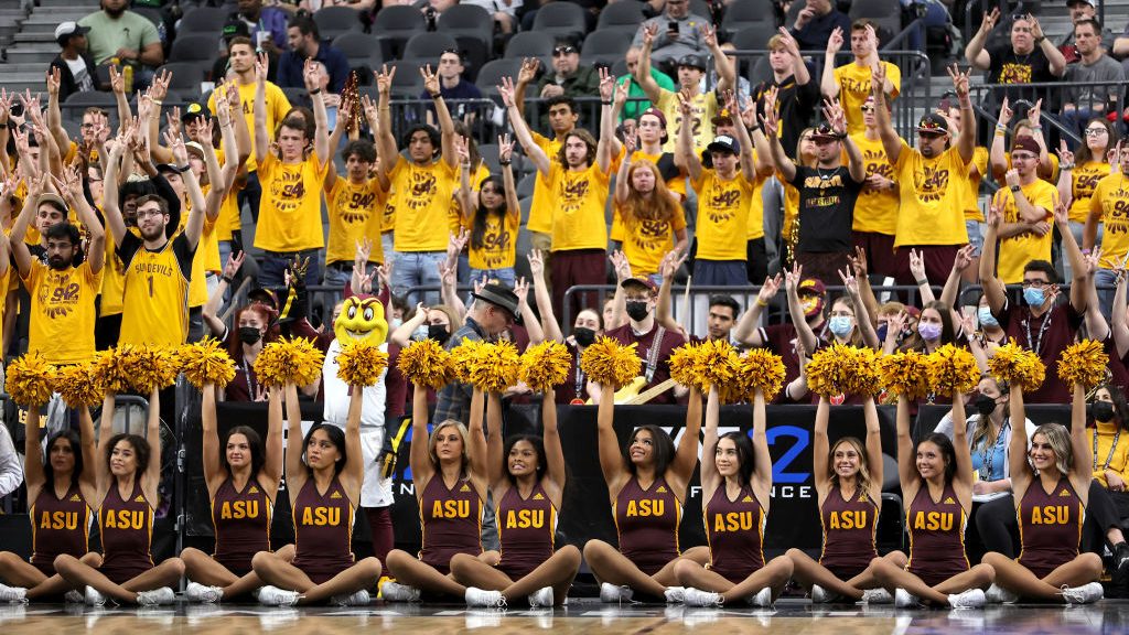 Arizona State Sun Devils fans and cheerleaders raise their arms during the team's game against the ...
