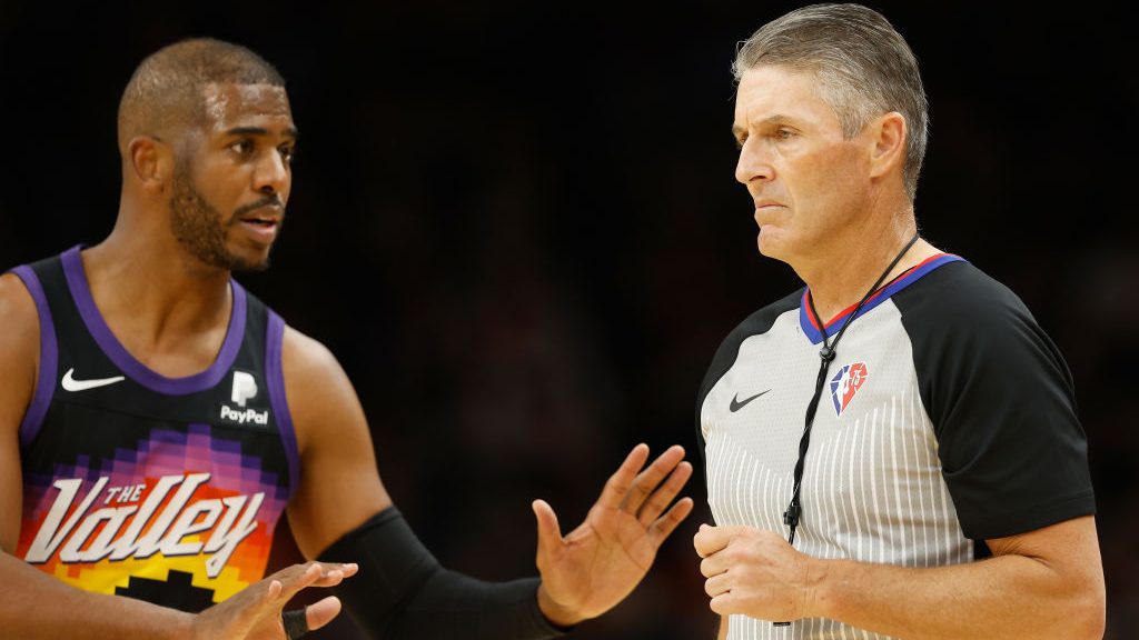 Referee Scott Foster #48 listens to Chris Paul #3 of the Phoenix Suns during the second half of the...