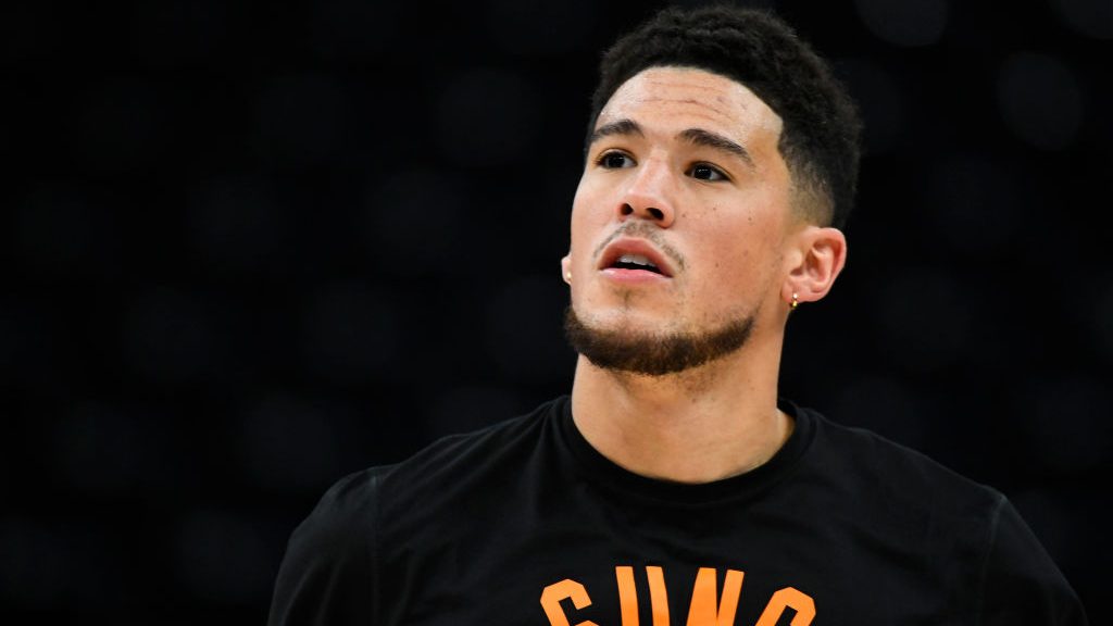 Devin Booker #1 of the Phoenix Suns warms up before a game against the Utah Jazz at Vivint Smart Ho...