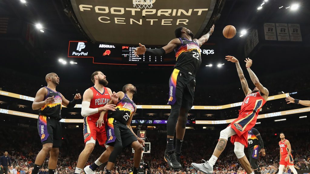 Brandon Ingram #14 of the New Orleans Pelicans attempts a shot against Deandre Ayton #22 of the Pho...