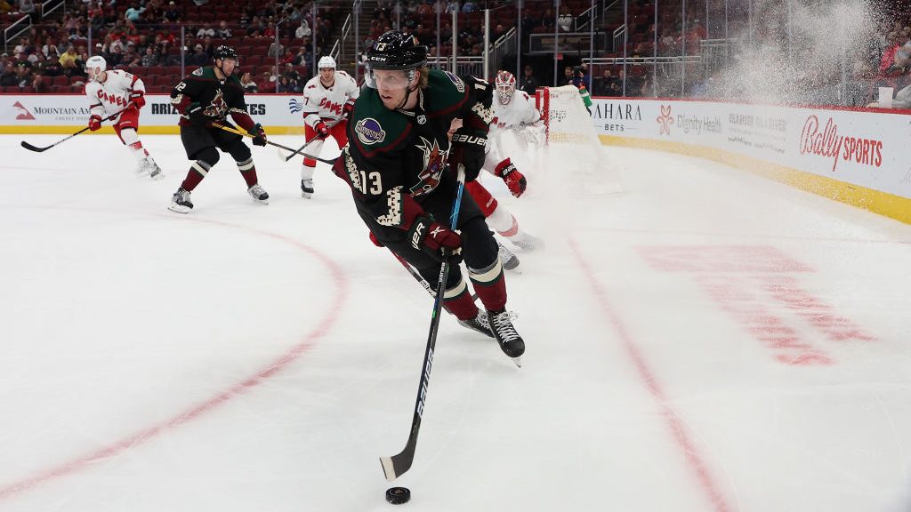 Nathan Smith #13 of the Arizona Coyotes skates with the puck during the second period of the NHL ga...