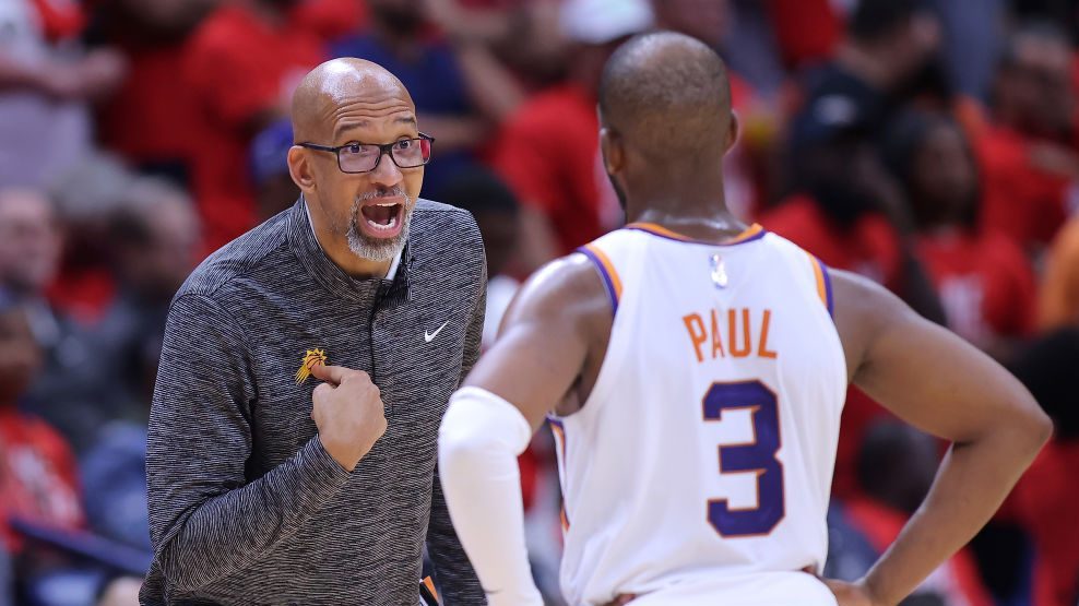 Head coach Monty Williams of the Phoenix Suns talks to Chris Paul #3 during the second half of Game...
