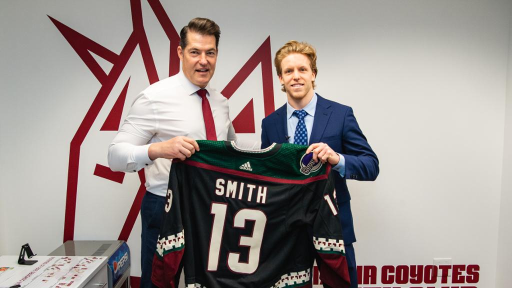 Nathan Smith signs his contract at Gila River Arena on April 11, 2022 in Glendale, Arizona. (Photo ...