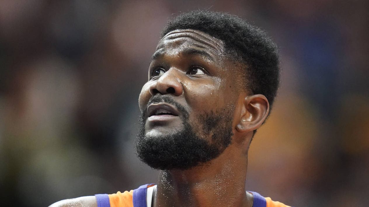 Phoenix Suns center Deandre Ayton looks at the scoreboard during the first half of the team's NBA b...