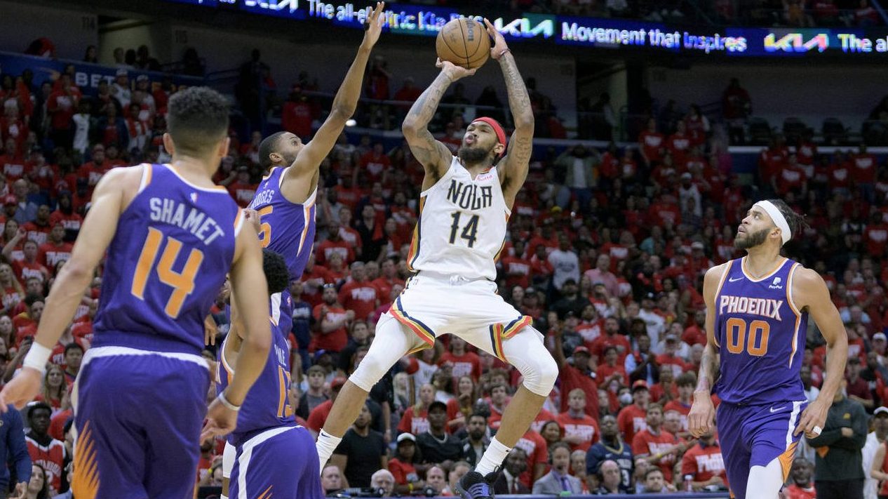 New Orleans Pelicans forward Brandon Ingram (14) shoots against Phoenix Suns forward Mikal Bridges ...