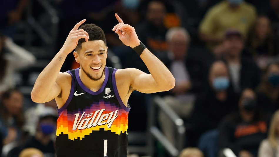 Devin Booker #1 of the Phoenix Suns reacts during the first half of the NBA game at Footprint Cente...