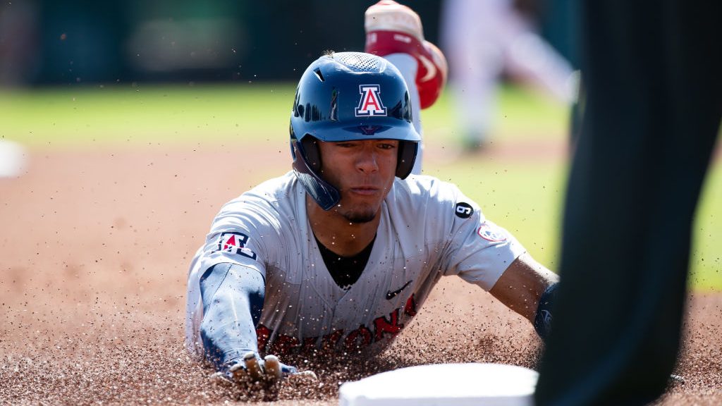 Arizona Wildcats Outfielder Chase Davis (5)  slides into third base during game 1 of the PAC12 Base...