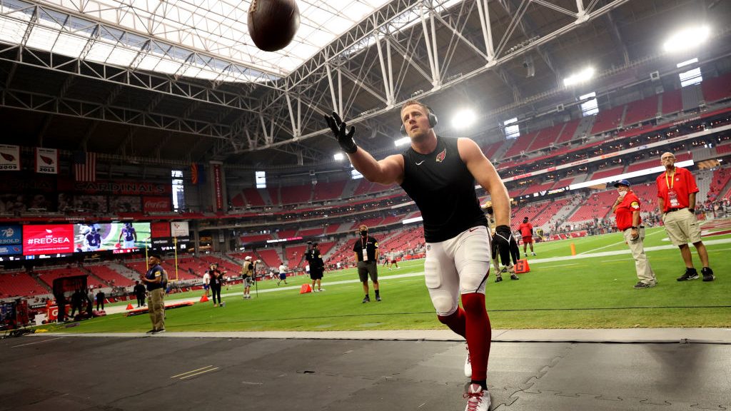 J.J. Watt #99 of the Arizona Cardinals plays catch with fans before the game against the Houston Te...