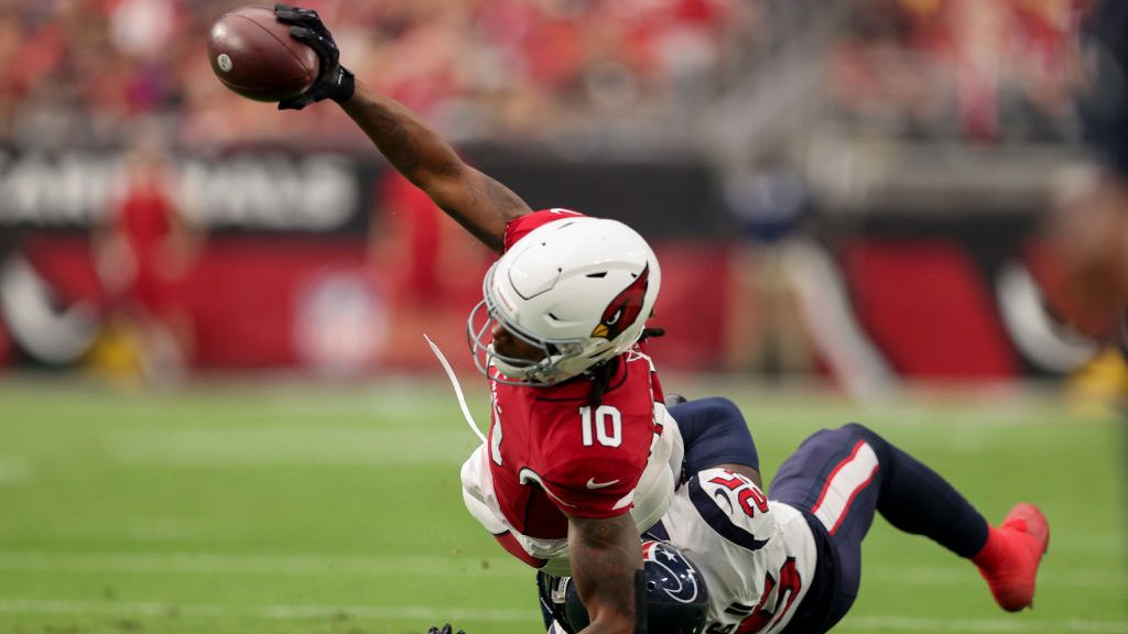 DeAndre Hopkins #10 of the Arizona Cardinals runs with the ball while being tackled by Desmond King...