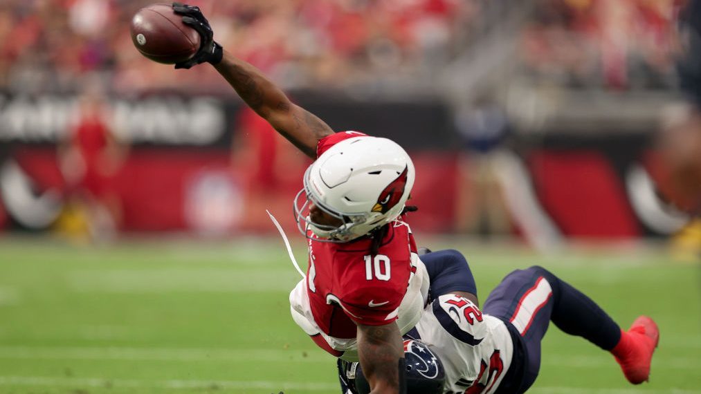 DeAndre Hopkins #10 of the Arizona Cardinals runs with the ball while being tackled by Desmond King...