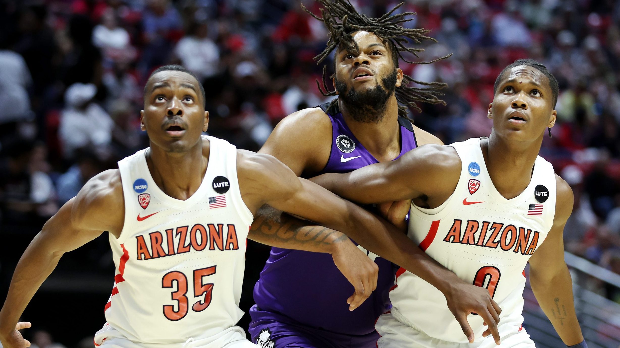 Christian Koloko #35 and Bennedict Mathurin #0 of the Arizona Wildcats compete for position with Ed...