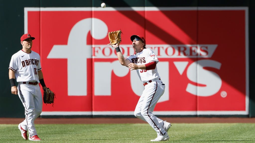 Outfielder Jake McCarthy #30 of the Arizona Diamondbacks catches a fly ball during the MLB game aga...