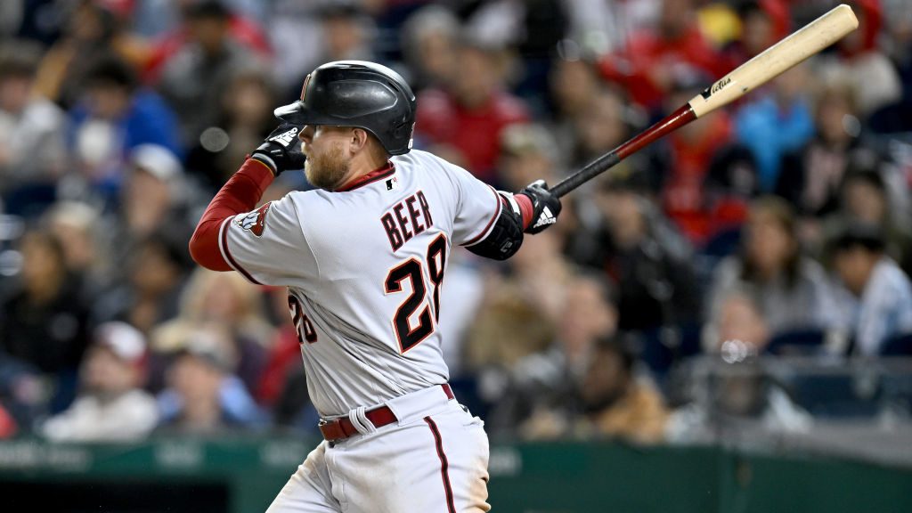 Seth Beer #28 of the Arizona Diamondbacks drives in two runs with a double in the fourth inning aga...