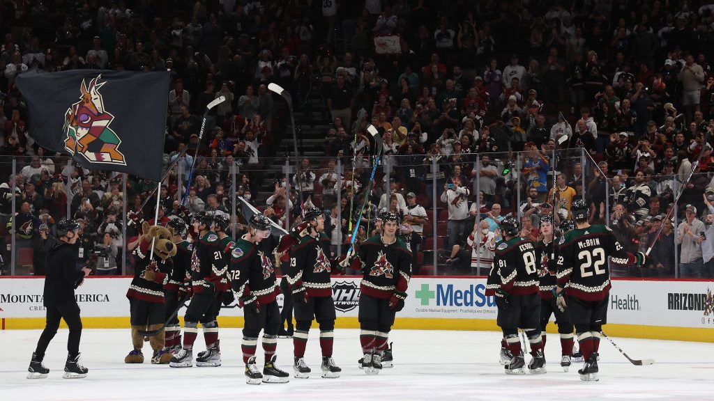 The Arizona Coyotes celebrate after defeating the Nashville Predators in the NHL game at Gila River...