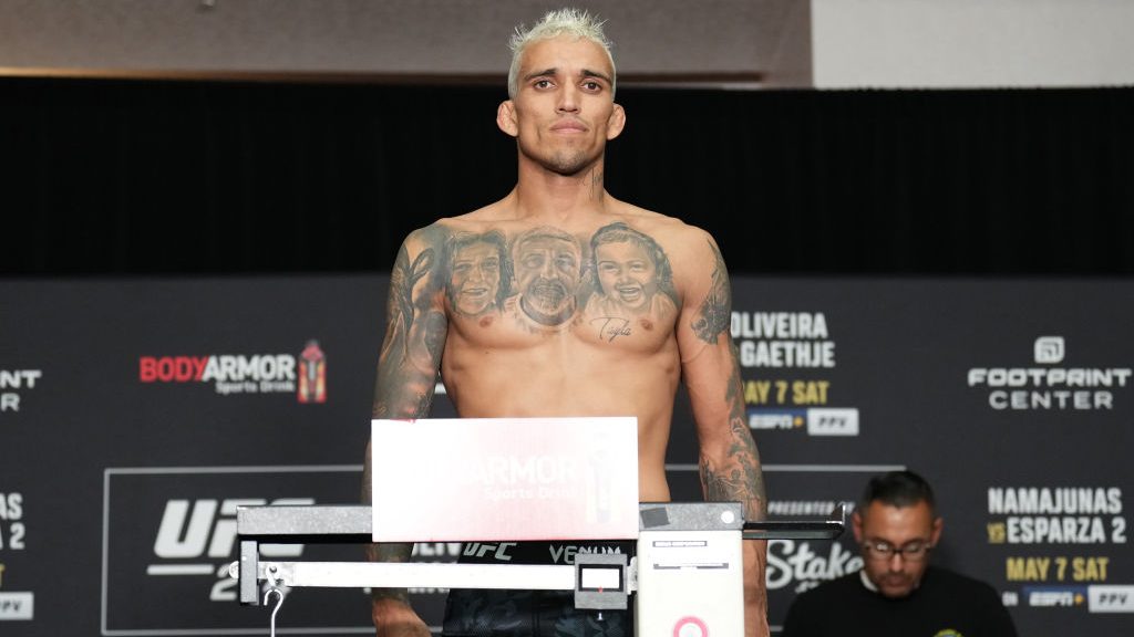 Charles Oliveira of Brazil poses on the scale during the UFC 274 official weigh-in at the Hyatt Reg...