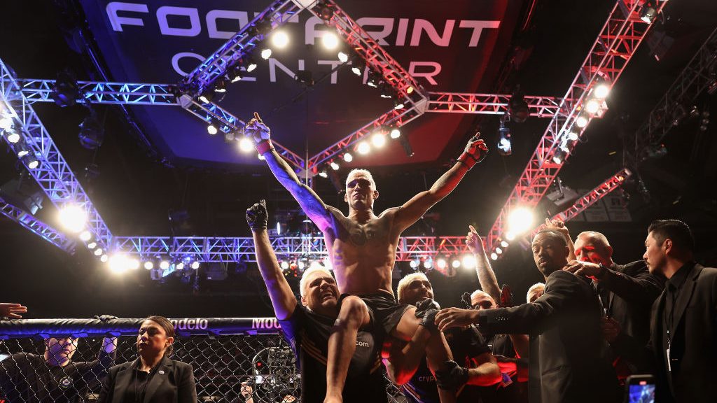 Charles Oliveira of Brazil celebrates after his submission victory over Justin Gaethje (not picture...