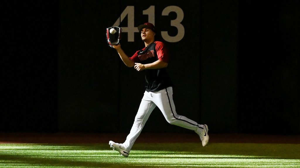 Alek Thomas #5 of the Arizona Diamondbacks catches a fly ball during batting practice prior to a ga...