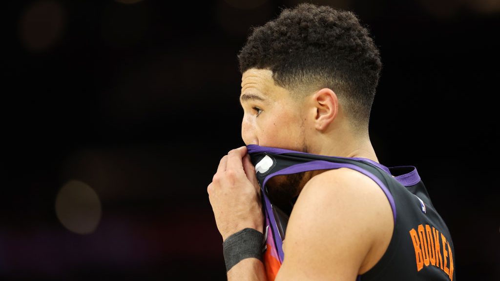 Devin Booker #1 of the Phoenix Suns reacts during the first half in Game Seven of the 2022 NBA Play...