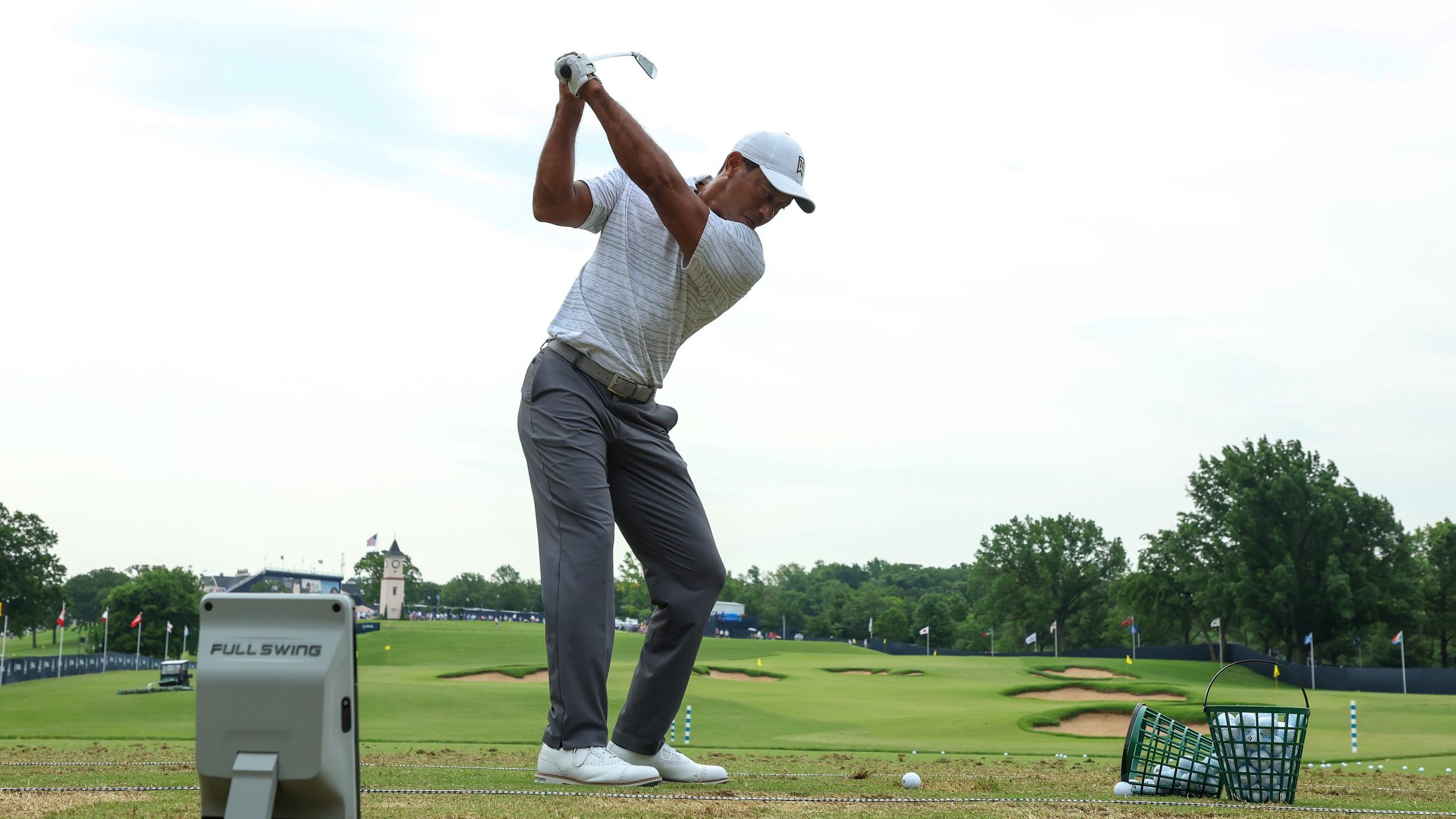 Tiger Woods of the United States warms up on the range during a practice round prior to the start o...