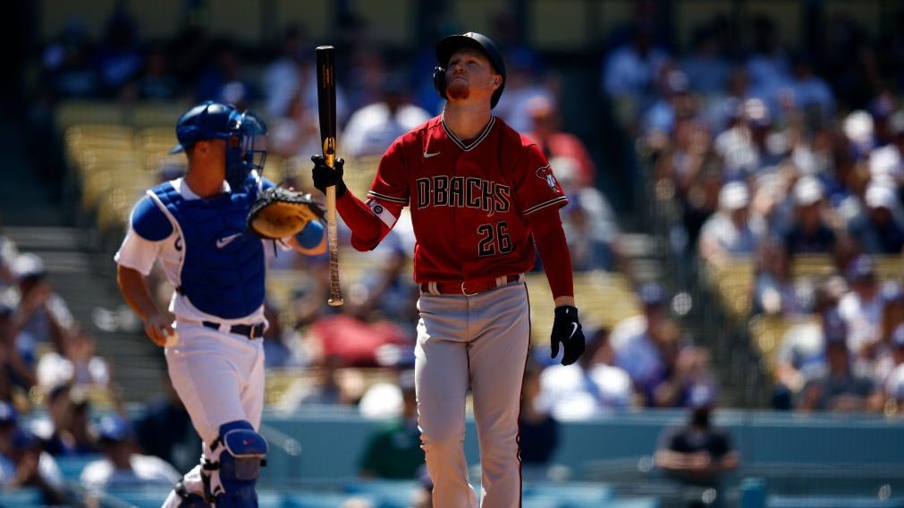 Pavin Smith #26 of the Arizona Diamondbacks strikes out against the Los Angeles Dodgers in the fift...