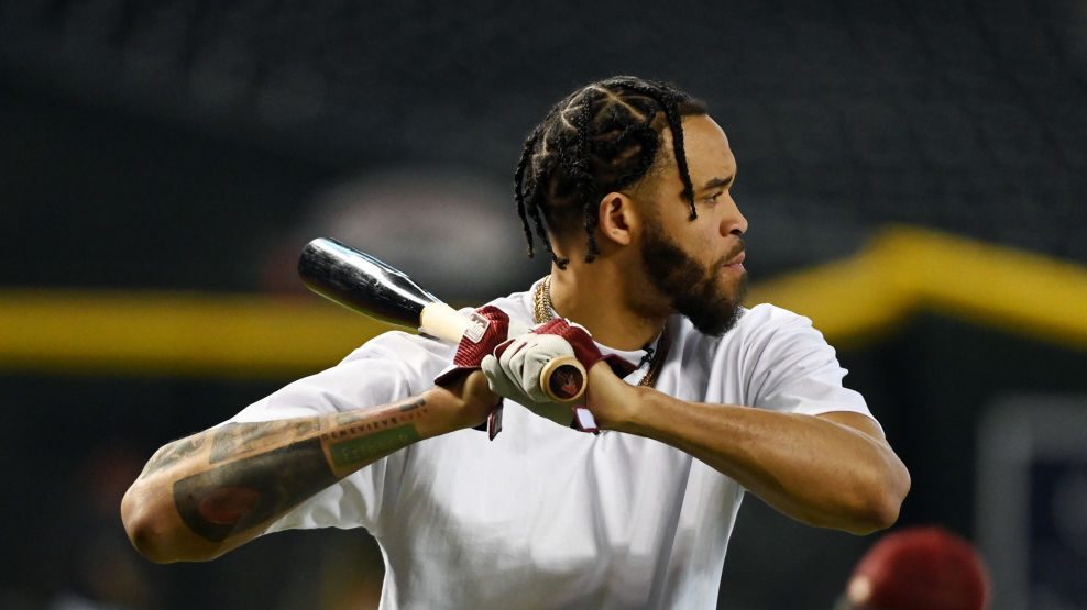 NBA player JaVale McGee #00 of the Phoenix Suns takes batting practice prior to a game between the ...