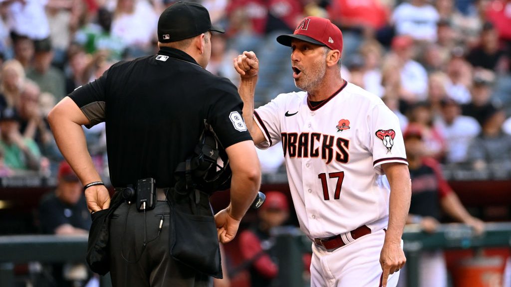 Manager Torey Lovullo #17 of the Arizona Diamondbacks is thrown out of the game by home plate umpir...
