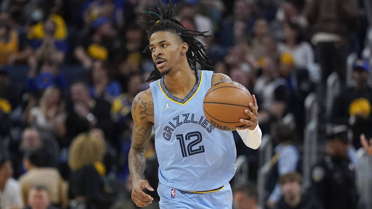 Memphis Grizzlies guard Ja Morant brings the ball up against the Golden State Warriors during the s...
