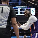 Phoenix Suns forward Jae Crowder (99) argues a call with referee Rodney Mott (71) during the second half of Game 3 of an NBA basketball second-round playoff series against the Dallas Mavericks, Friday, May 6, 2022, in Dallas. (AP Photo/Tony Gutierrez)