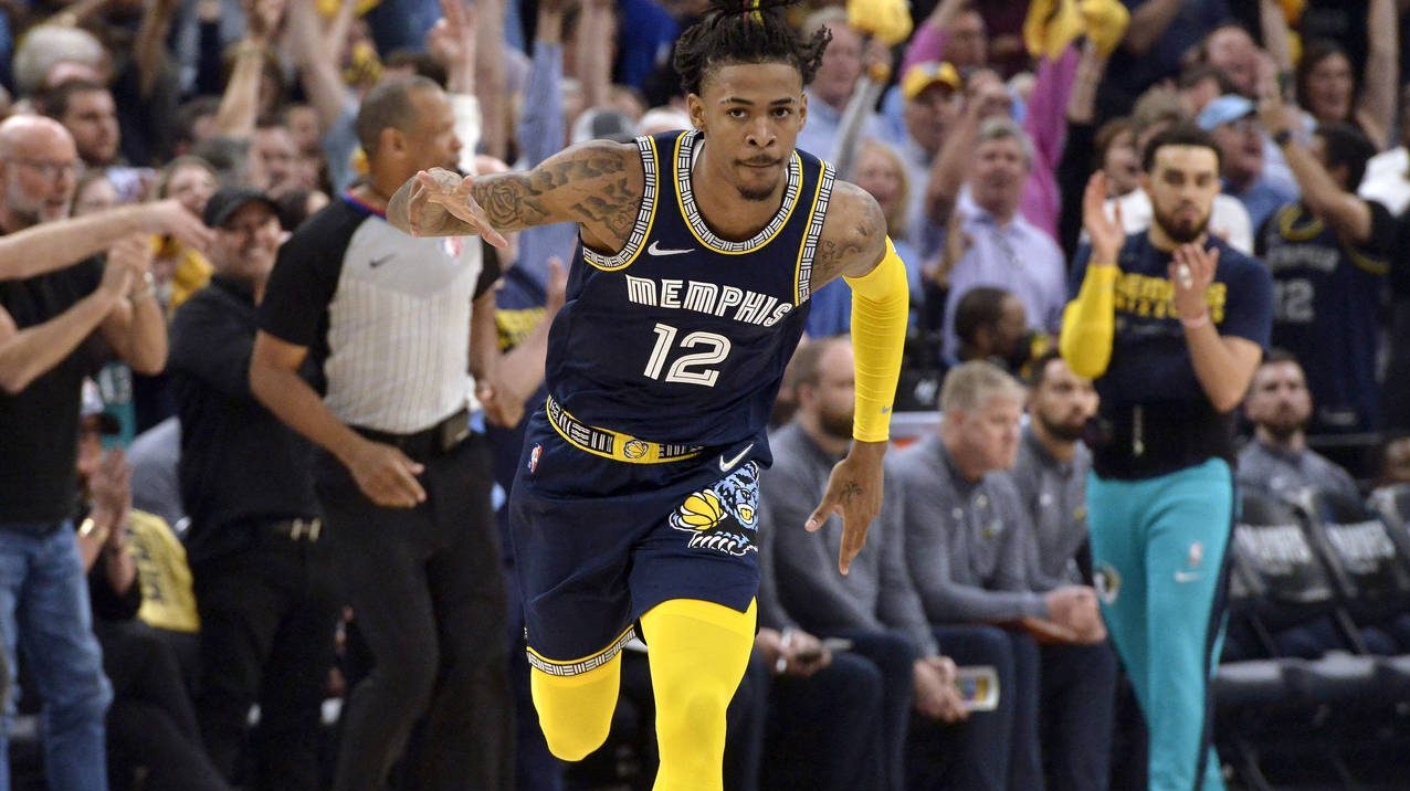 Memphis Grizzlies guard Ja Morant (12) reacts after scoring during the first half of Game 2 of a se...