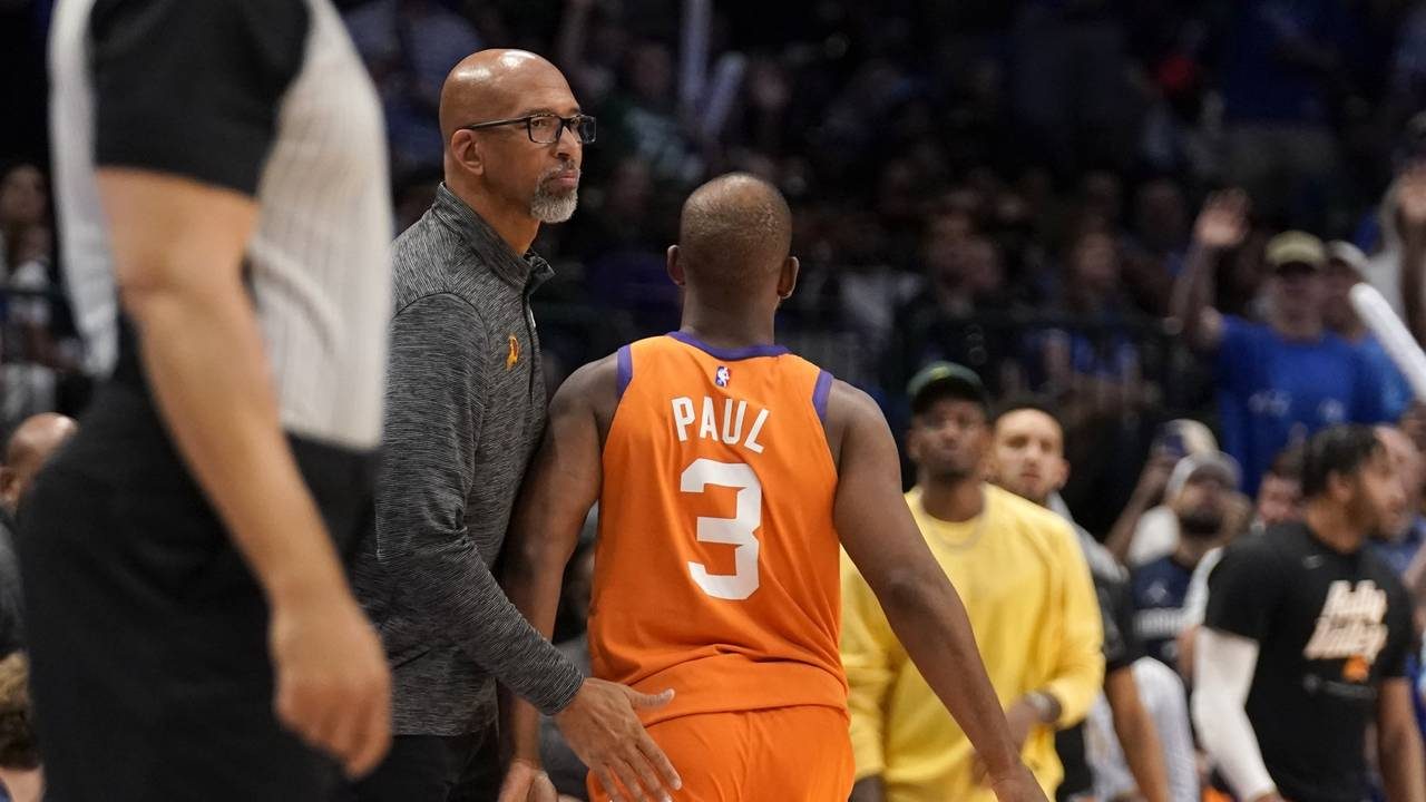 Phoenix Suns head coach Monty Williams, left, greets, Chris Paul (3) at the bench after Paul fouled...