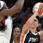 Phoenix Mercury's Diana Taurasi (3) shoots as Las Vegas Aces' Jackie Young (0) defends during the second half of a WNBA basketball game Friday, May 6, 2022, in Phoenix. (AP Photo/Darryl Webb)