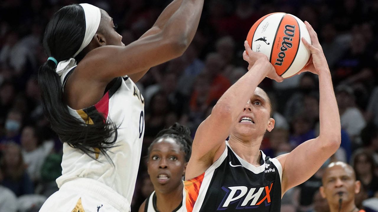 Phoenix Mercury's Diana Taurasi (3) shoots as Las Vegas Aces' Jackie Young (0) defends during the s...