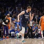 Dallas Mavericks forward Davis Bertans (44) celebrates after sinking a 3-point basket in the first half of Game 4 of an NBA basketball second-round playoff series against the Phoenix Suns, Sunday, May 8, 2022, in Dallas. (AP Photo/Tony Gutierrez)