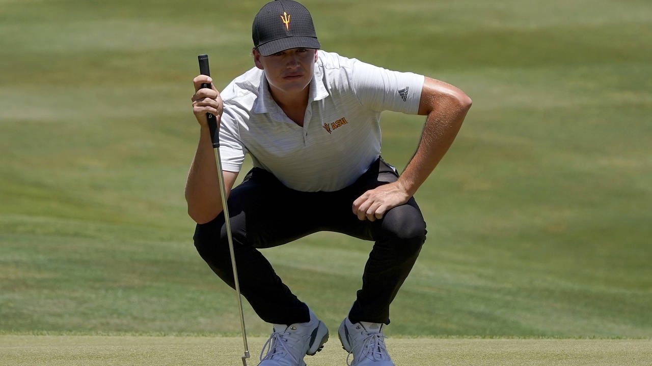 Arizona State golfer Preston Summerhays lines up his shot on first green during the semifinal round...